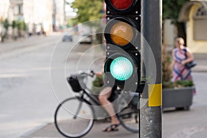 Girl on a bicycle at the traffic light