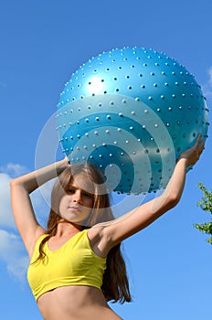 Girl with big ball for fitness