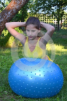 Girl with big ball for fitness