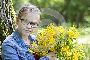 Girl with big bouquet of spring flowers