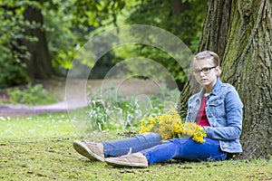 Girl with big bouquet of spring flowers