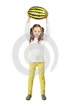 Girl with big toy watermelon on a white background.