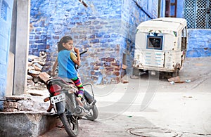 Girl on the bike in Blue city