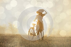 Girl on a bike in the countryside