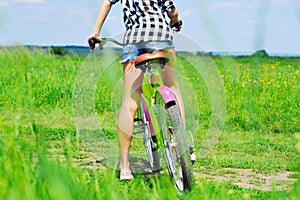 Girl on bike rare view