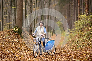 The girl on a bike from the rental in the forest.