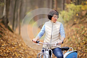 The girl on a bike from the rental in the forest.