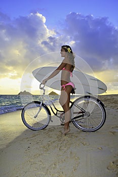 Girl with bike and surfboard