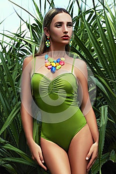 Girl in bikini on island jungle