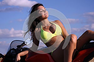 Girl in bikini on motorcycle