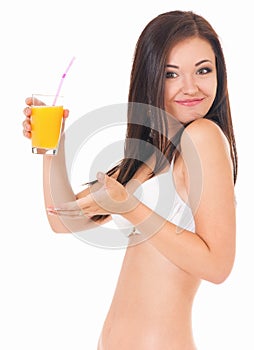 Girl in bikini with orange juice