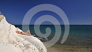 Girl in bikini sunbathing