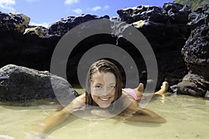 Girl in bikini in a tide pool