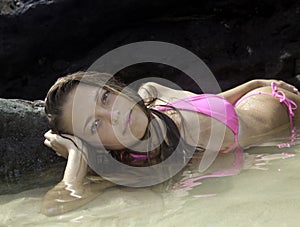 Girl in bikini in a tide pool