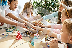 Girl birthday decorations. table setting with cakes, drinks and party gadgets.