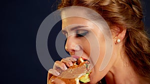 Girl bite hamburger. Homemade Fast Food burger