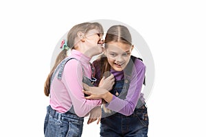 Girl bites her sisters ear having fun