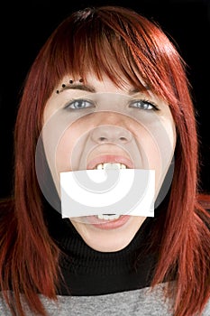 Girl biting a blank greeting card