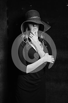 Girl in black dress and hat