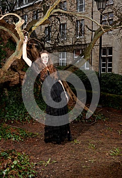 Girl in a black dress in the park