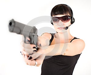 Girl in black dress with pistol