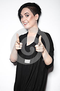 Girl in a black dress with shaved head in art gothic style.