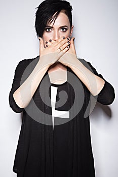 Girl in a black dress with shaved head, art gothic style.