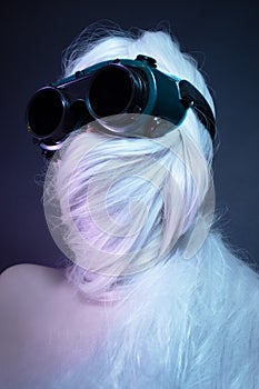 Girl in black glasses with long white hair wrapped around her head