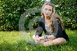 Girl in black on the grass