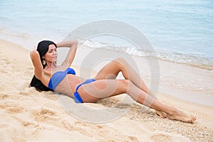 girl with black hair in a bathing suit