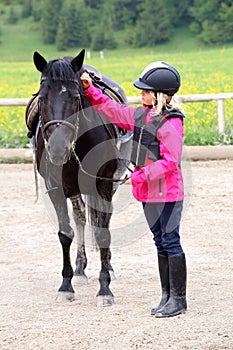 Girl and black horse