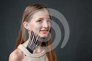 Girl with black striped kinesiology tape placed on the neck