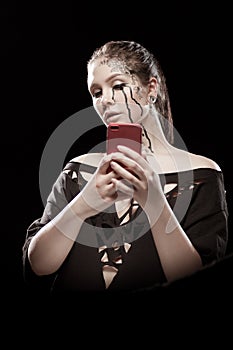 Girl with black tears from eyes and lace pattern on face and neck