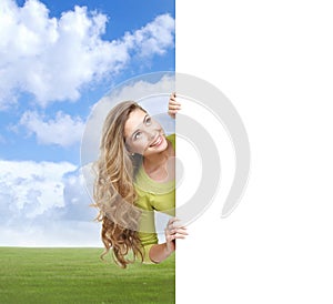 Girl with a blank banner. Perfect space to put any text.