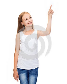 Girl in blank white shirt pointing to something