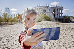 Girl blogger records film and makes selfie over abandoned building for her channel, local tourism