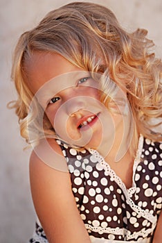 Girl with blond curly hair.