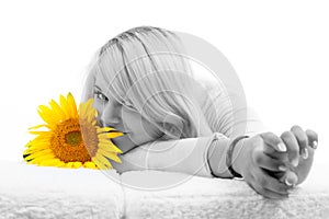 Girl with blonde hair with sunflowers