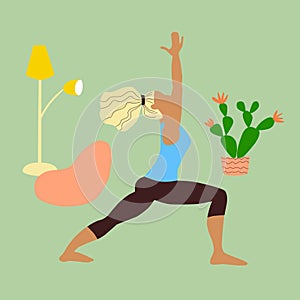 Girl blonde in a tracksuit doing yoga at home during quarantine. Young slender woman in a warrior pose. Interior floor lamp bean