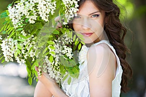 Girl in blooming garden