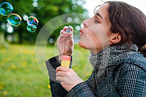 Girl blow soap bubble