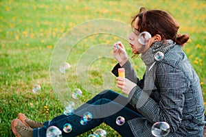 Girl blow soap bubble