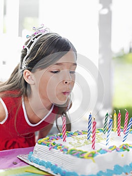 Girl Blowing Birthday Candles