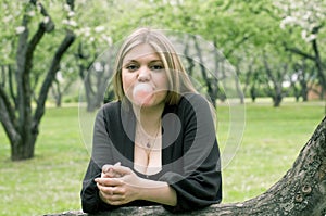 Girl blowing bubble with bubble gum