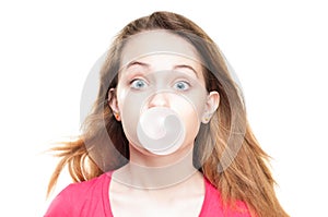 Girl blowing bubble from chewing gum