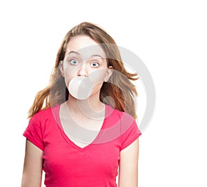 Girl blowing bubble from chewing gum