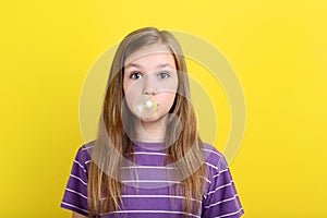 Girl blowing bubble gum