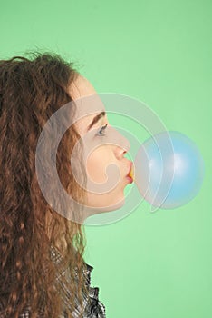 Girl blowing a bubblegum bubble
