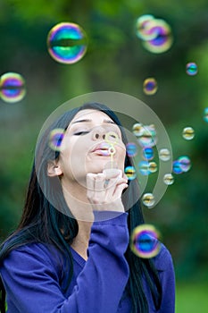 Girl blowing bubbles