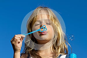 Girl blowing bubbles